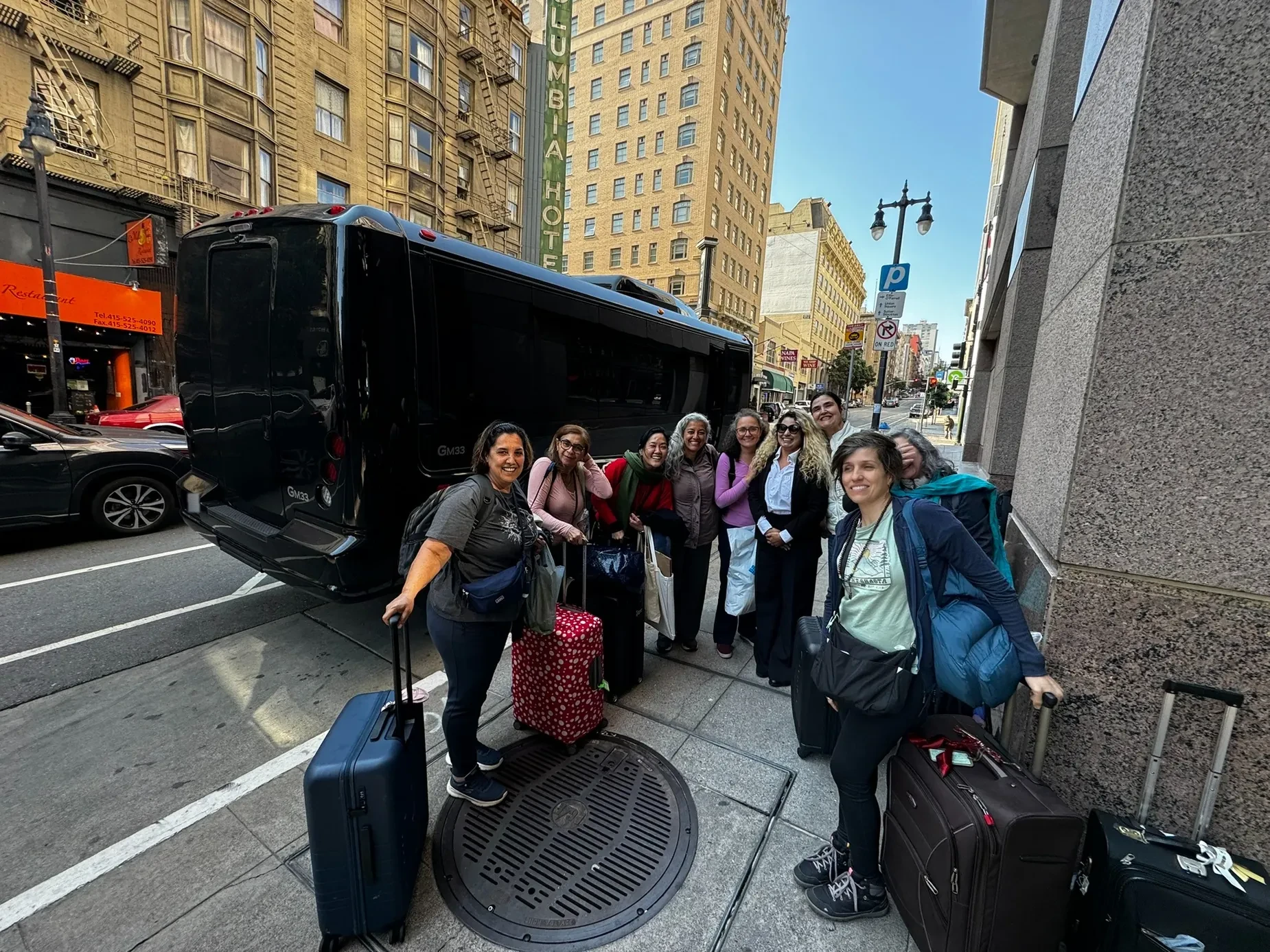 Group travelers beside an executive shuttle in San Francisco