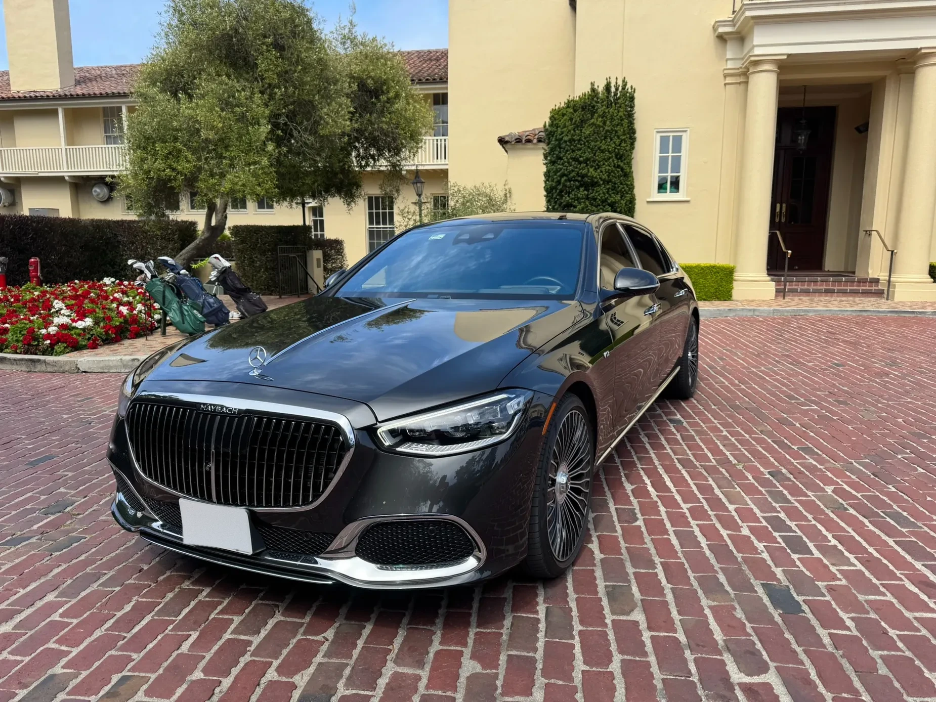 Mercedes-Maybach luxury sedan on a brick driveway